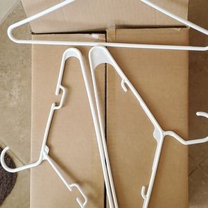 35 White plastic hangers
